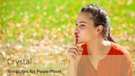  Presentation with forefinger - PPT theme consisting of young beautiful brunette woman has put forefinger to lips as sign of silence against green summer garden background and a yellow colored foreground