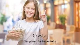  Presentation with snack - PPT theme featuring young beautiful girl eating popcorn snack isolated background surprised with an idea or question pointing finger with happy face number one background and a coral colored foreground