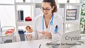  Presentation with fetus - PPT theme having young-beautiful-hispanic-woman-gynecologist background and a soft green colored foreground