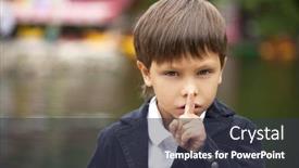  Presentation with forefinger - Theme with young beautiful little boy has put forefinger to lips as sign of silence background and a tawny brown colored foreground