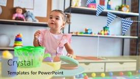  Presentation with cutlery food - Presentation design featuring young beautiful toddler playing with cutlery and food toys on the table at kindergaten background and a soft green colored foreground