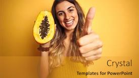  Presentation with papaya - Audience pleasing theme consisting of young beautiful woman holding papaya over yellow isolated background happy with big smile doing ok sign thumb up with fingers excellent sign backdrop and a gold colored foreground