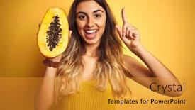  Presentation with papaya - Beautiful PPT layouts featuring young beautiful woman holding papaya over yellow isolated background surprised with an idea or question pointing finger with happy face number one backdrop and a gold colored foreground