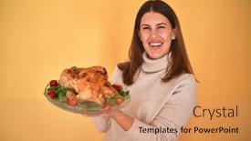  Presentation with young business woman smile show - Amazing presentation having young beautiful woman smiling proud holding thanksgiving turkey chicken on a tray over yellow background backdrop and a coral colored foreground