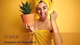  Presentation with emotion - Beautiful presentation theme featuring young beautiful woman wearing a towel holding aloe vera pot over yellow isolated background screaming proud and celebrating victory and success very excited cheering emotion backdrop and a gold colored foreground