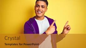  Presentation with new orleans yellow and purple - Colorful presentation design enhanced with young brazilian man wearing purple sweatshirt standing over isolated yellow background smiling and looking at the camera pointing with two hands and fingers to the side backdrop and a gold colored foreground