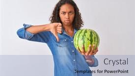  Presentation with negative - PPT theme consisting of young brazilian woman holding watermelon standing over isolated white background with angry face negative sign showing dislike with thumbs down rejection concept background and a teal colored foreground