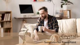  Presentation with online snack - Beautiful presentation featuring young casual man with mug of hot drink looking at laptop display while sitting on sofa watching online video and having snack backdrop and a coral colored foreground