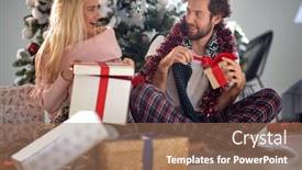  Presentation with christmas presents - PPT theme having young-caucasian-couple-opening-christmas background and a coral colored foreground