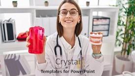  Presentation with denture - PPT theme having young-caucasian-dentist-woman-holding background and a soft green colored foreground