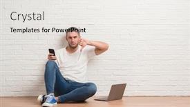  Presentation with white brick wall - Beautiful presentation theme featuring young caucasian man sitting over white brick wall using computer laptop and smartphone with angry face negative sign showing dislike with thumbs down rejection concept backdrop and a white colored foreground