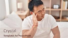  Presentation with ear pain - PPT theme having young-chinese-man-suffering background and a soft green colored foreground