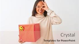  Presentation with happy birthday - Presentation consisting of young chinese woman wearing glasses holding birthday gift over isolated white background with happy face smiling doing ok sign with hand on eye looking through fingers background and a coral colored foreground