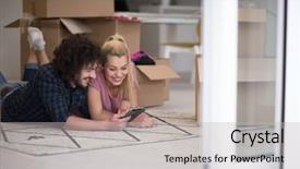  Presentation with new ideas - PPT theme having young couple in love moving in a new flat lying on the floor and surfing the web on a tablet computer in search of new redecoration ideas background and a light gray colored foreground