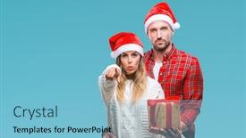  Presentation with confident love - Beautiful PPT theme featuring young couple in love wearing christmas hat and holding present over isolated background pointing with finger to the camera and to you hand sign positive and confident gesture from the front backdrop and a light blue colored foreground