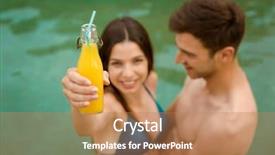  Presentation with juices - Amazing PPT theme having young couple inside the pool and drinking natural juices backdrop and a coral colored foreground