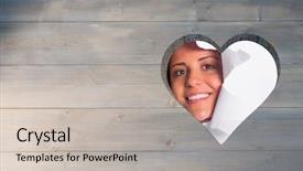  Presentation with rip paper - PPT theme having young couple looking through paper rip against heart in wood background and a soft green colored foreground