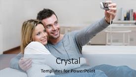  Presentation with digital self - PPT theme consisting of young couple taking a self portrait with digital camera at home background and a light blue colored foreground
