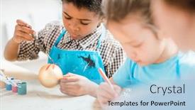 Presentation with classmates - Amazing slide set having young creative boy sitting by desk among his classmates and painting golden christmas toy ball at lesson backdrop and a light blue colored foreground