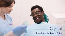  Presentation with artificial teeth - Presentation theme with young-female-dentist-showing background and a sky blue colored foreground