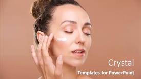  Presentation with serum - Audience pleasing PPT theme consisting of young-gorgeous-woman-applying-facial backdrop and a coral colored foreground