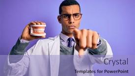  Presentation with denture - Presentation theme having young-handsome-african-american-dentist background and a light blue colored foreground