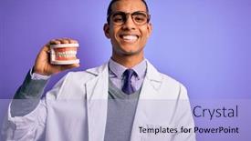  Presentation with denture - Presentation theme having young-handsome-african-american-dentist background and a light blue colored foreground