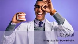  Presentation with denture - Amazing theme having young-handsome-african-american-dentist backdrop and a light blue colored foreground