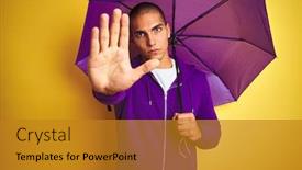  Presentation with defense - PPT theme featuring young handsome man wearing purple umbrella over yellow isolated background with open hand doing stop sign with serious and confident expression defense gesture background and a gold colored foreground