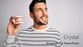  Presentation with denture - PPT theme enhanced with young-handsome-man-with-beard background and a light gray colored foreground