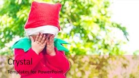  Presentation with elf - Slide set featuring young happy child dressed as santa helper elf xmas costume green outdoor background background and a red colored foreground