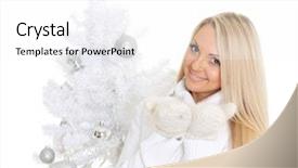  Presentation with free christmas - Theme enhanced with young happy woman in winter clothes stands near christmas tree on a white background and holds an imaginary object in a hand free space for advertising of your product background and a white colored foreground