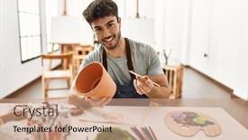  Presentation with pottery - PPT theme having young-hispanic-artist-man-smiling background and a coral colored foreground