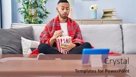  Presentation with popcorn movie - Presentation theme having young-hispanic-man-eating-popcorn background and a coral colored foreground