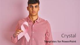  Presentation with pink ribbon - Presentation featuring young indian man holding cancer ribbon standing over isolated pink background with a confident expression on smart face thinking serious background and a coral colored foreground