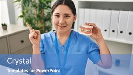  Presentation with denture - PPT theme consisting of young-latin-dentist-woman-holding background and a teal colored foreground