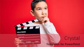  Presentation with clapboard - Audience pleasing PPT theme consisting of young-little-boy-kid-filming backdrop and a red colored foreground