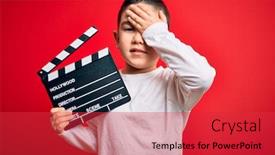  Presentation with angry kid - Cool new PPT theme with young-little-boy-kid-filming backdrop and a red colored foreground