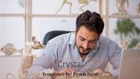  Presentation with lab animals - PPT theme having young-male-paleontologist-examining-ancient background and a coral colored foreground