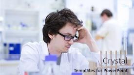  Presentation with scientific research - Cool new PPT theme with young male researcher carrying out scientific research in a chemistry lab shallow dof color toned image backdrop and a light blue colored foreground