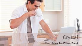  Presentation with social isolation - Cool new slides with young man drinking some coffee while working on his laptop in the kitchen working from home in quarantine lockdown social distancing self isolation backdrop and a soft green colored foreground