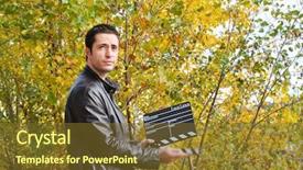  Presentation with cinema - PPT theme with young man holding a cinema clap background and a tawny brown colored foreground