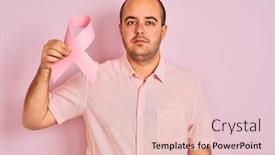  Presentation with cancer - Cool new slide deck with young man holding cancer ribbon symbol standing over isolated pink background with a confident expression on smart face thinking serious backdrop and a lemonade colored foreground