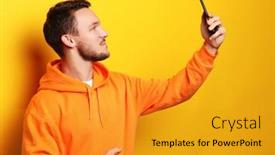  Presentation with man holding phone - Theme having young man holding mobile phone and making photo of himself while standing against yellow background background and a gold colored foreground