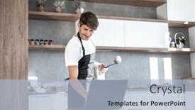  Presentation with laptop - PPT theme consisting of young man looking at laptop screen while cooking dinner background and a light blue colored foreground