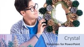  Presentation with decoration - Beautiful slide set featuring young man making christmas decoration backdrop and a teal colored foreground