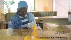  Presentation with tablet - PPT theme consisting of young-man-using-his-tablet background and a coral colored foreground