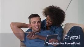  Presentation with computers - Slide set consisting of young multiethnic couple relaxing at luxurious home with tablet computers reading in the living room on the sofa couch background and a ocean colored foreground