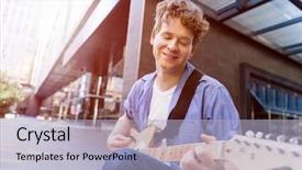  Presentation with guitar - Amazing PPT theme having young musician with guitar in city backdrop and a light blue colored foreground