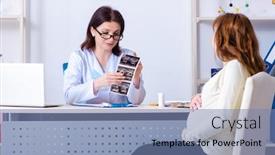  Presentation with gynecologist - Audience pleasing PPT theme consisting of young-pregnant-woman-visiting-experienced backdrop and a seafoam green colored foreground